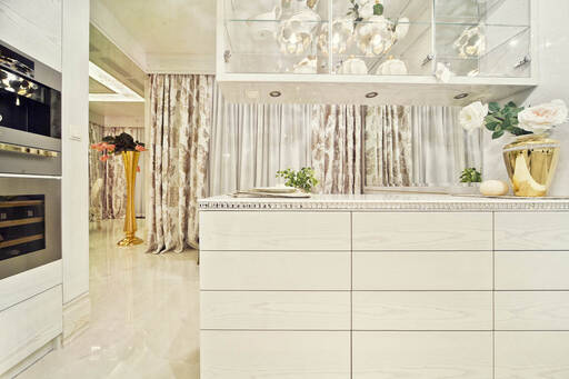 Lidia Bersani / Luxury Interior - Modern Kitchen finished in glossy white wood. Top - white marble with Swarovski decorations. 