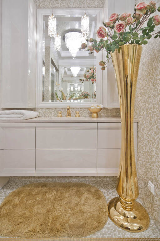 Lidia Bersani / Luxury Interior - Beautiful Bathroom, gold  rug, gold high vase, gold tap with Swarovski, the bathroom vanity in high gloss  cream color