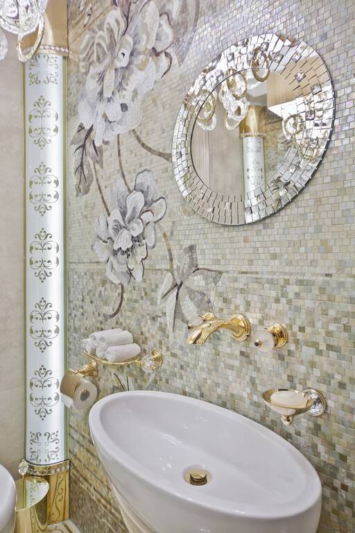Lidia Bersani / Luxury Interior - Small guest toilet. Floral mosaic on the wall. Elegant walls lamps finishing gold and Swarovski crystals.
