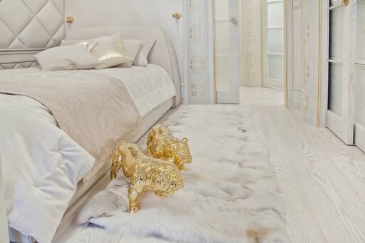 Lidia Bersani / Luxury Interior - Wooden white floor, Rug - fox fur. Golden dogs with Swarovski crystals
